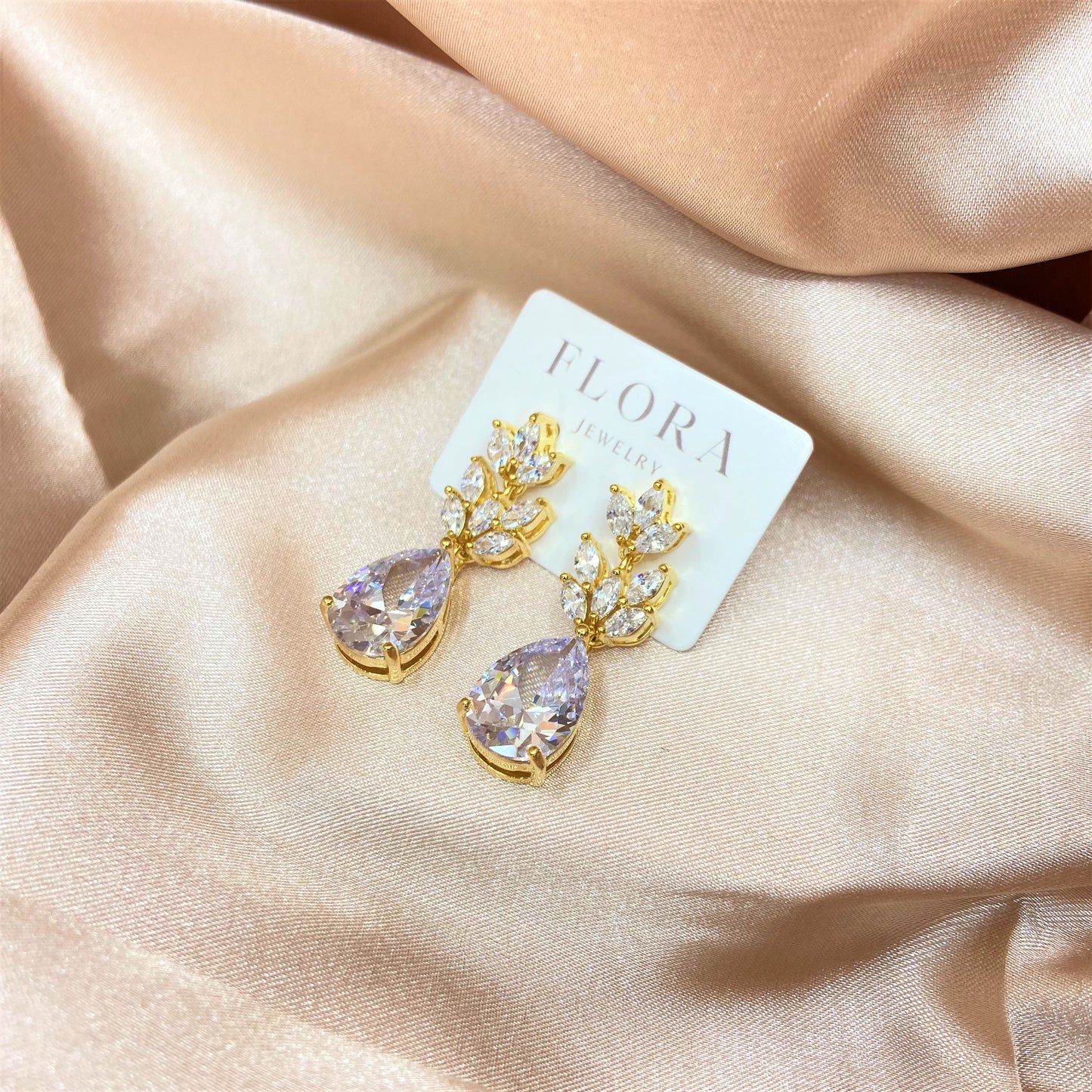 gold earrings with floral details for wedding day